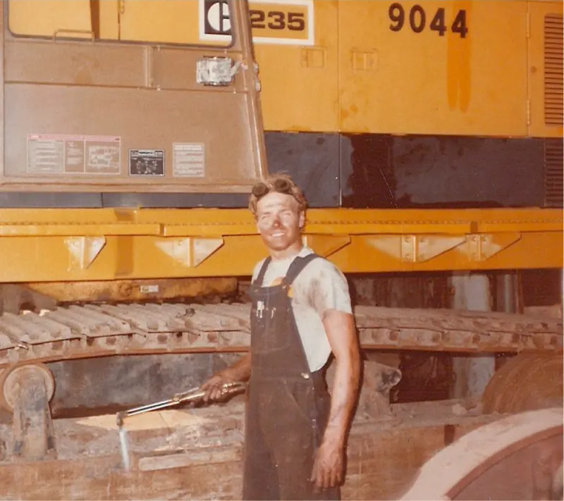 Grabowski operator in front of a CAT 235 excavator (machine #9044).