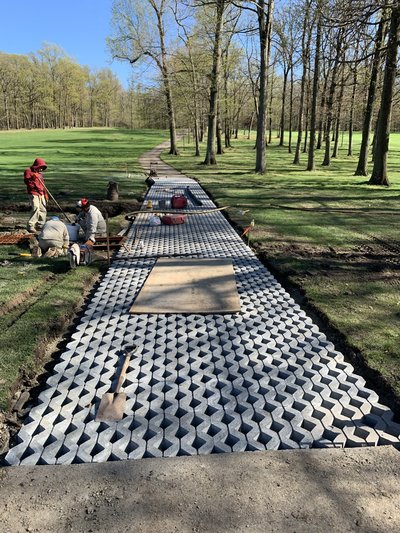 Cart-path matting install on the fairway at Crestmont.