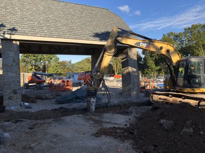 Hydraulic hammer and excavator at the entry of Crestmont.